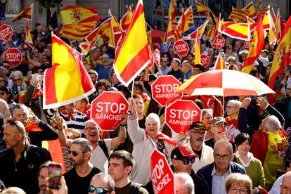 Spanish flags and posters against Pedro Sanchez, during the rally in Sant Jaume square in Barcelona. 