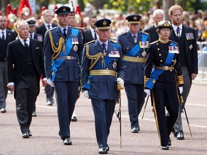 Charles III and other members of the British royal family walk behind Queen Elizabeth II’s coffin on Wednesday in London, en route to Westminster Hall.