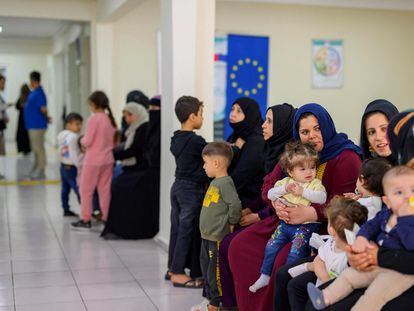 A group of Syrian refugees wait in a Şanlıurfa migration center in southeastern Turkey on October 17.