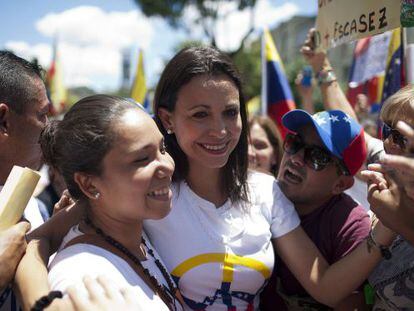 Deputy María Corina Machado (center) with supporters.