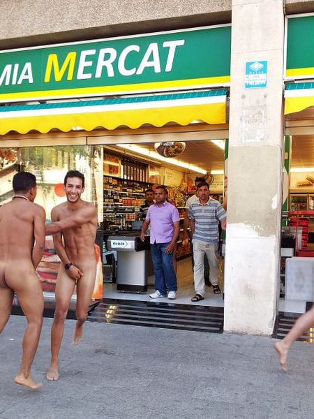 Three Italian tourists running around naked in Barceloneta on Friday.