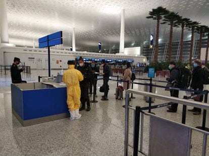 Spaniards undergoing passport checks at the airport.