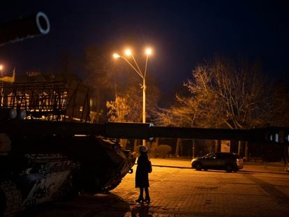 A woman stands in front of a display of destroyed Russian tanks and armored vehicles in downtown Kyiv, Ukraine, Friday, Jan. 20, 2023.