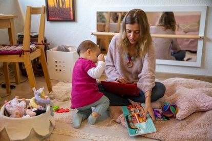 María Guruceta works remotely while looking after her 15-month-old daughter at home in Madrid. 