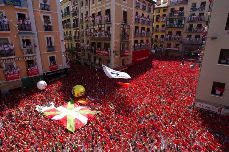 Some revelers at Pamplona City Hall displayed the Basque flag.
