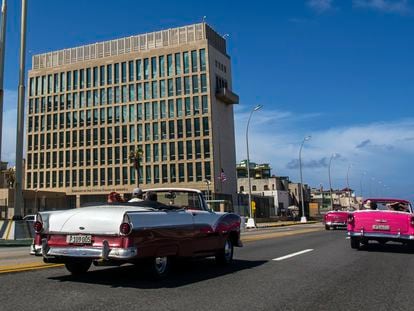 Tourists ride classic convertible cars on the Malecon beside the United States Embassy in Havana, Cuba, in October 2017.