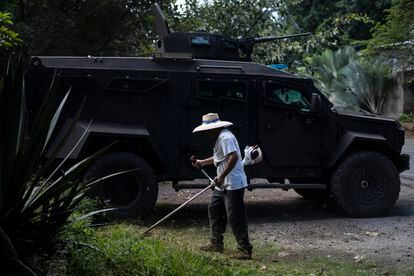 Army combat vehicles guard the entrance to Sensuntepeque, El Salvador.