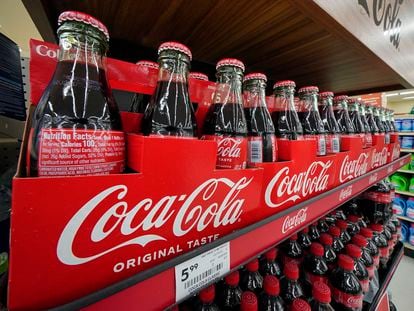 Bottles of Coca-Cola are on display at a grocery market in Uniontown, Pa, on Sunday, April 24, 2022.