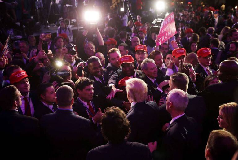 Donald Trump greets supporters following his election win.