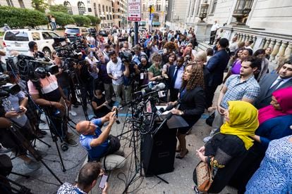 State's Attorney for Baltimore Marilyn Mosby (c-r) speaks to the media after a judge vacated the murder conviction of Adnan Syed.