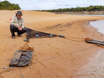Researcher Carlos A. Lasso works on the banks of the Orinoco River.