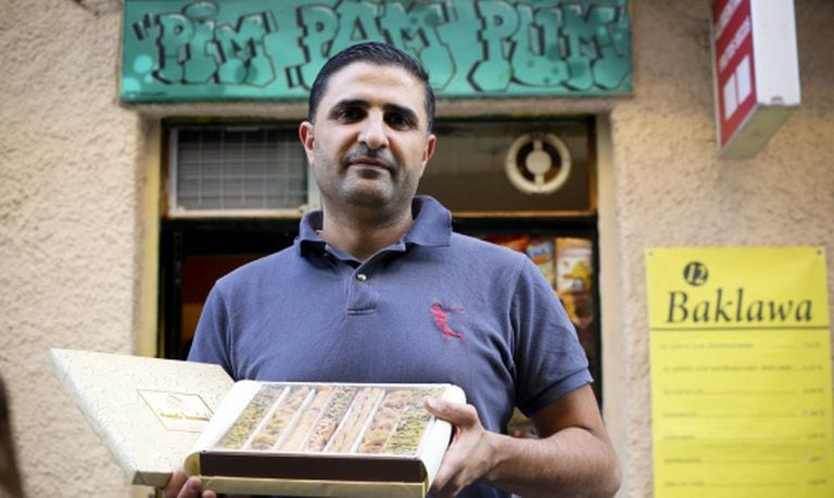 Abud Alkarmi outside his Madrid pastry store, Pim Pam Pum.