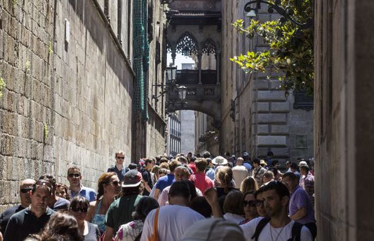 Tourists filling up Barcelona's Gothic neighborhood.