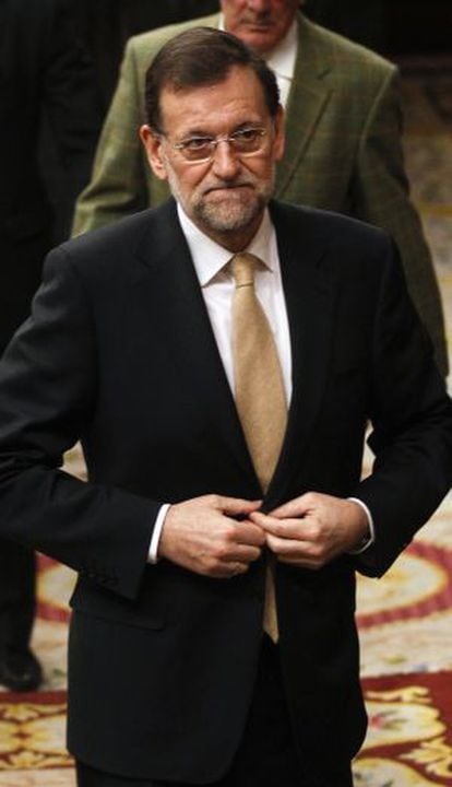 Spain's Prime Minister Mariano Rajoy leaves a parliamentary session.