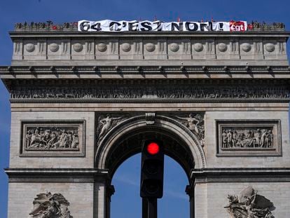 CGT unionists display a giant banner written "64, it's no" on the top of the Arc de Triomphe monument, Wednesday, April 5, 2023, in Paris.