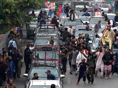 A convey of former Prime Minister Imran Khan drive toward Islamabad at a road in Lahore, Pakistan, Saturday, March 18, 2023.