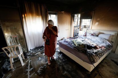A woman inspects the damage to her home in Ashkelon following a Palestinian missile attack.