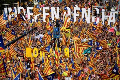 People wave pro-independence flags at the march for the Diada, or National Day of Catalonia, in 2018.