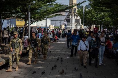 Soldiers patrol Plaza La Libertad in San Salvador's historic downtown.