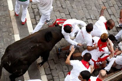 A bull horn connects with flesh near the Plaza Consistorial in Pamplona.