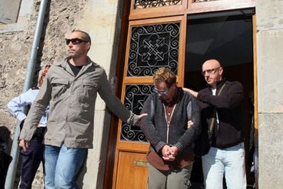 Joan Vila is taken away under arrest from the La Caritat d'Olot residential care home.