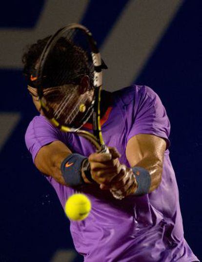 Rafael Nadal of Spain hits a return to Diego Sebastian Schwartzman of Argentina at the Mexico ATP Open.