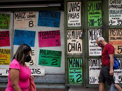 A grocery store with U.S. currency price signs in the windows of the La Candelaria neighborhood in Caracas, Venezuela.