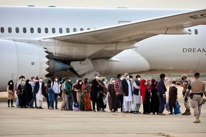 A group of Afghans arrives at the Torrejón de Ardoz air base on Tuesday.