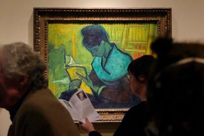 Visitors file past at the Van Gogh painting "Une Liseuse De Romans", also known as "The Novel Reader", during the Van Gogh in America exhibit at the Detroit Institute of Arts, Wednesday, Jan. 11, 2023, in Detroit.