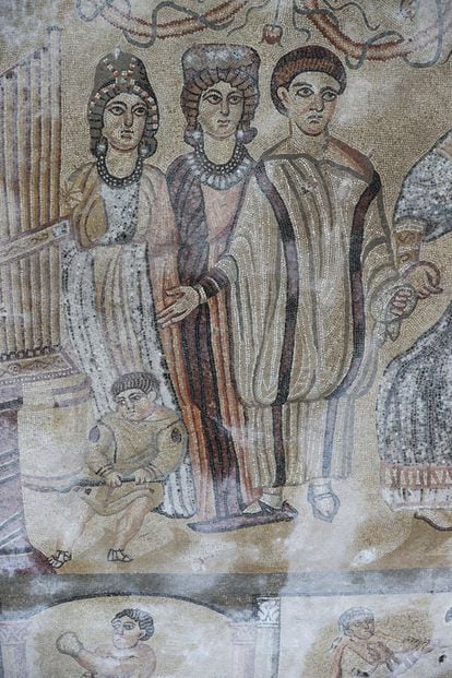 A scene showing one of the two pantomimes represented in the mosaic. One of the characters is wearing a long, solid shoe that was used to keep time to the music. This is one of the very few remaining representations of this item in the world.