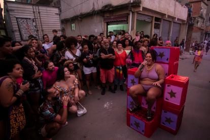 Artist Jaqueline Andrade (c) during an LGBTQ+ art show titled "Noite das Estrelas" or the Night of the Stars, at the Mare Favela complex, in Rio de Janeiro, Brazil, Sunday, June 25, 2023.