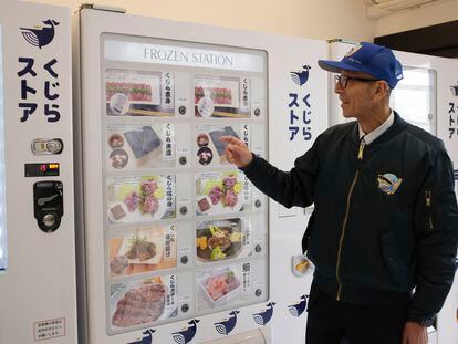 Konomu Kubo, a spokesperson for Kyodo Senpaku Co. explains how whale meat is being sold from a vending machine at the firm's store, Thursday, Jan. 26, 2023, in Yokohama, Japan.