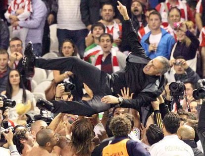 Real Madrid coach Jos&eacute; Mourinho is tossed in the air by his players after the team sealed the Liga title at San Mam&eacute;s.