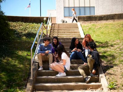 Upper Darby High School students Rayan Hansali, from left, Tanveer Kaur, Elise Olmstead, Fatima Afrani, Joey Ngo and Ata Ollah, talk in the campus courtyard, Wednesday, April 12, 2023, in Drexel Hill, Pa.