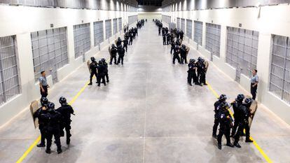Police officers standing guard inside the newly inaugurated prison, at an isolated rural area in a valley near Tecoluca, 74 km southeast of San Salvador