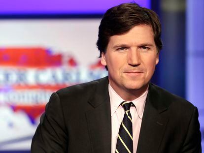 Tucker Carlson poses for photos in a Fox News Channel studio on March 2, 2017, in New York.