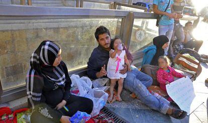 Kheder Ramadan with his family and other refugees outside the government offices in Ceuta.