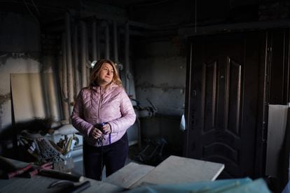 Valentina Bratkevich, a resident and administrator in Irpin, is adapting a basement for the winter. 