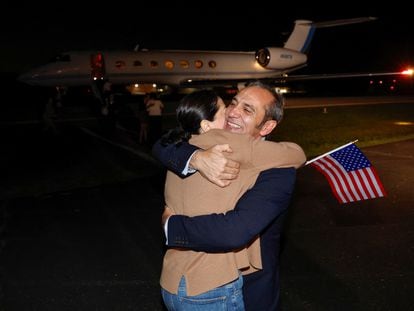 Family members embrace freed American Emad Shargi after he and four fellow detainees arrived at Davison Army Airfield at Fort Belvoir, Virginia, on September 19, 2023.