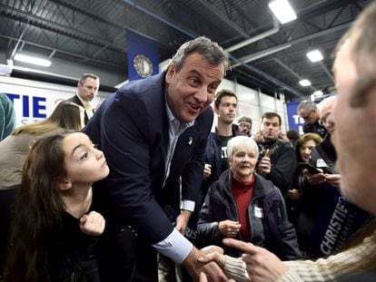 Then-New Jersey Governor Chris Christie shakes hands with supporters following an event to kick off a campaign bus tour in Exeter, New Hampshire, on December 19, 2015.