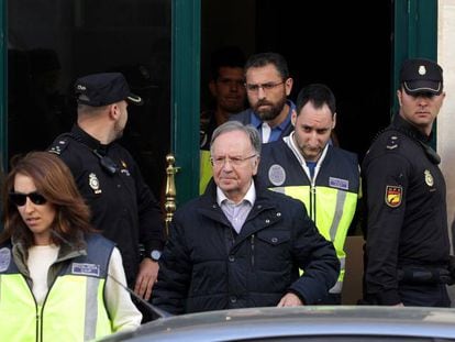 The head of Manos Limpias, Miguel Bernad, is taken away by police.