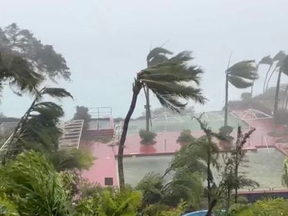 This video grab from the Twitter page of James Reynolds @EarthUncutTV shows tropical storm force winds blowing  across Tumon Bay, Guam on May 24, 2023.