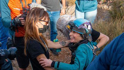 The climber Beatriz Flamini (right), is greeted as she emerges from a cave in southern Spain where she spent 500 days in isolation.
