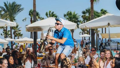 Be careful the saxophonist at Nikki Beach doesn't knock your drink over.