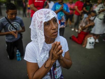 A woman praying in Managua, in March 2023.