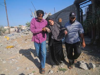 Palestinians evacuate a wounded woman after an Israeli airstrike in Rafah, Gaza Strip, on Friday.