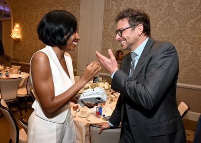 Ayo Edebiri chats with actor Bradley Cooper at the AFI Awards, held at the Four Seasons in Beverly Hills, January 12, 2024.