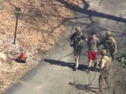 This image made from video provided by WCVB-TV, shows Jack Teixeira being taken into custody by armed tactical agents on April 13, 2023, in Dighton, Massachusetts.