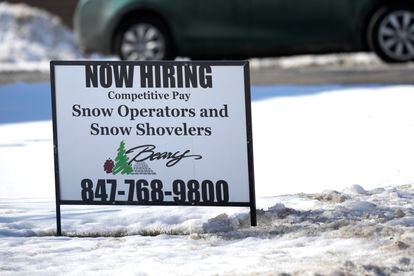 A hiring sign is displayed in Arlington Heights, Ill., Sunday, Feb. 5, 2022. On Thursday, the Labor Department reports on the number of people who applied for unemployment benefits last week.