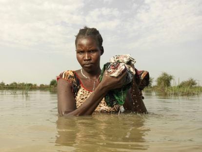 Nyasunday Dak Jal, 23, washes her undergarments in the village of Pakur, South Sudan.